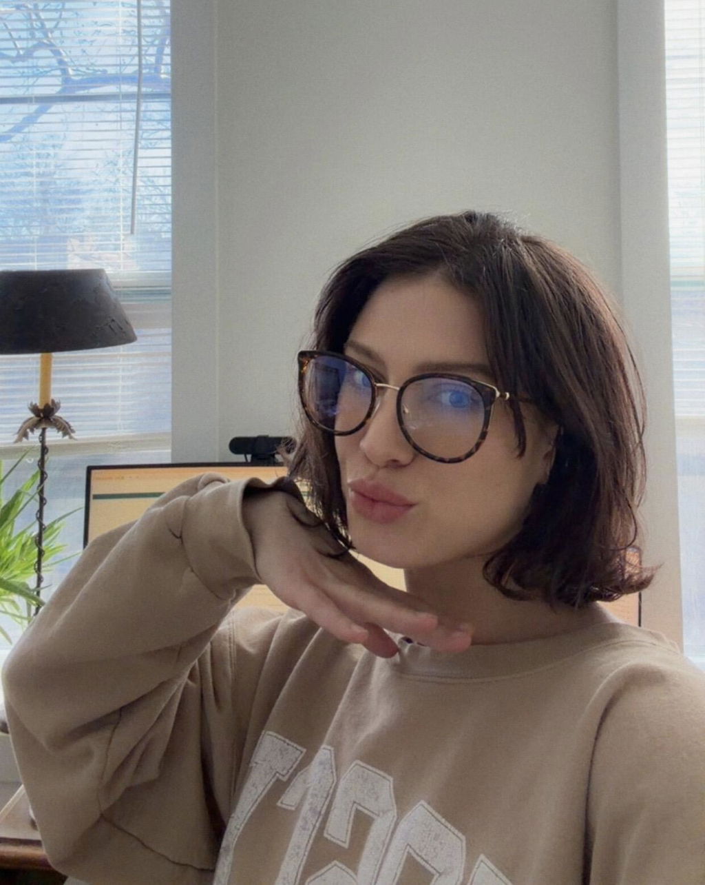 Kaelin wearing Bye Blue Light glasses