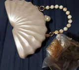 Marella Pearl Shell Clutch Bag – Elegant Acrylic Evening Handbag with Chain Strap