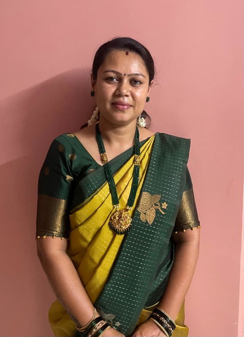 Long necklace with green semiprecious beads and Lakshmi pendants