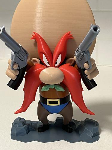 3D printed Yosemite Sam figure holding two pistols, printed in EconoFil Red PLA with six other EconoFil colours
