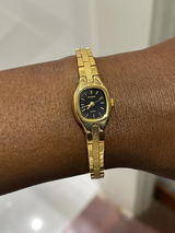 Pulsar by Seiko – Tiny Ladies’ Quartz Watch with Black Dial & Gold Bracelet