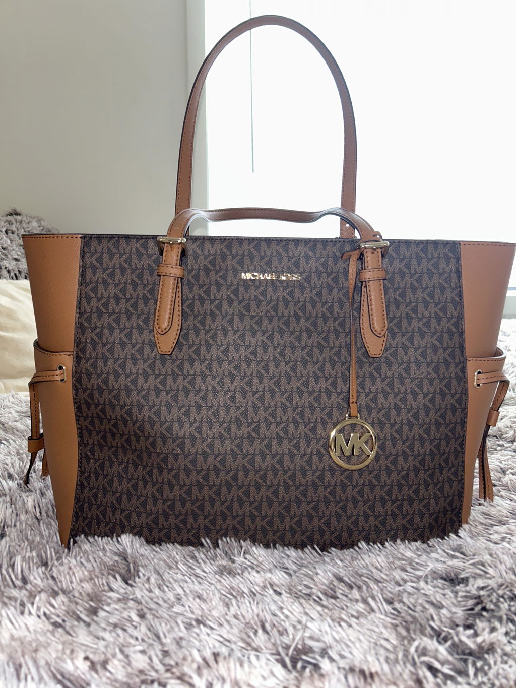 Customer photo for Michael Kors Gilly Large Jet Set Travel Drawstring Tote Brown MK Signature