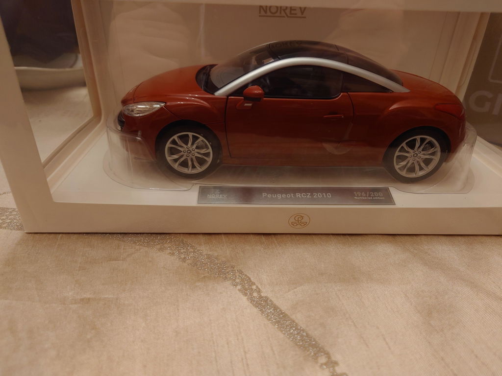 Peugeot RCZ 2010 Amber Red 1:18 - 200pcs – Norev