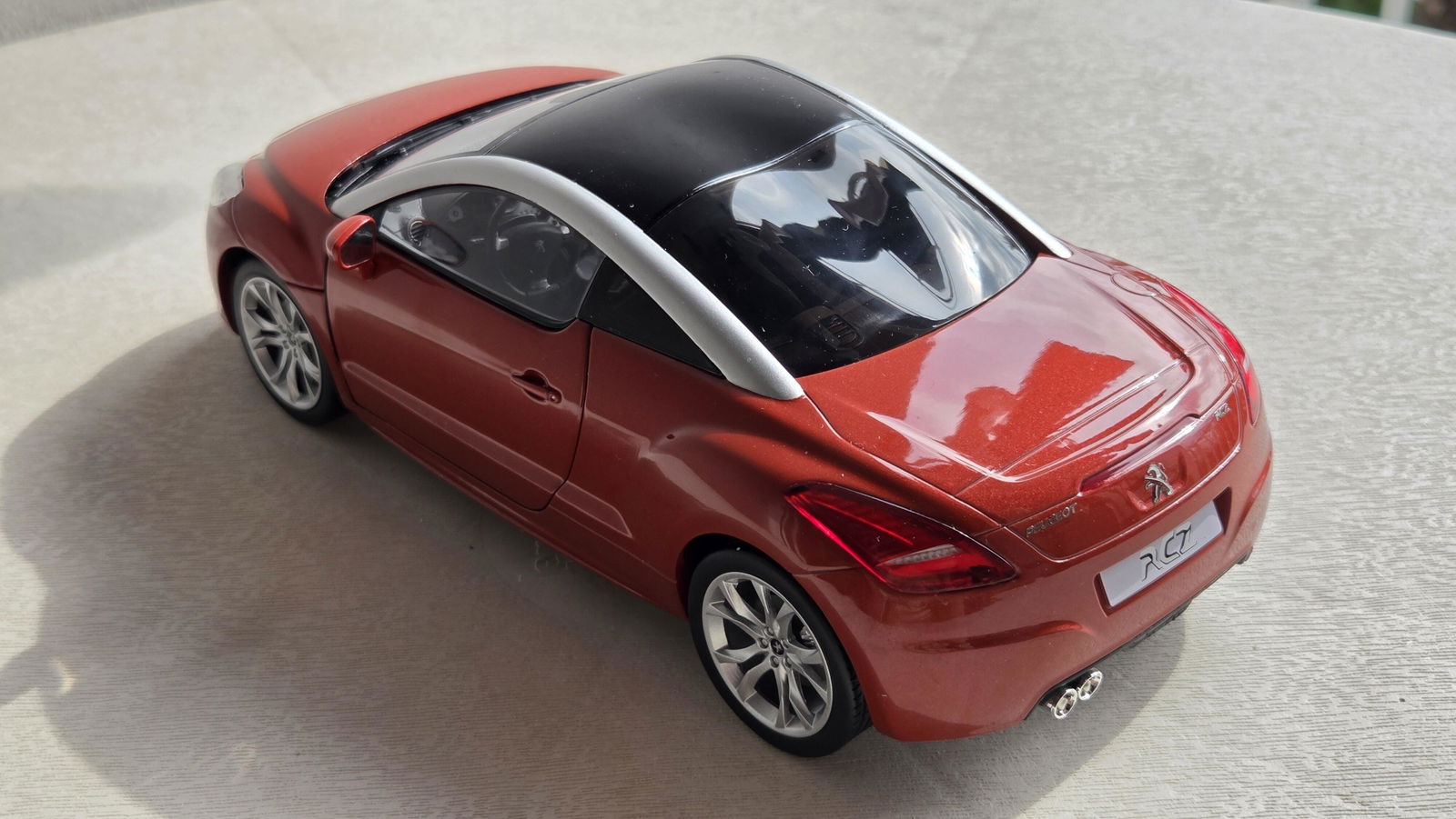 Peugeot RCZ 2010 Amber Red 1:18 - 200pcs – Norev