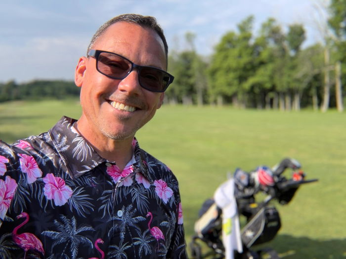 Joey wearing an Obnoxious Golf polo on the course