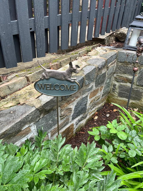 A Jaunty Welcome Sign on Stake